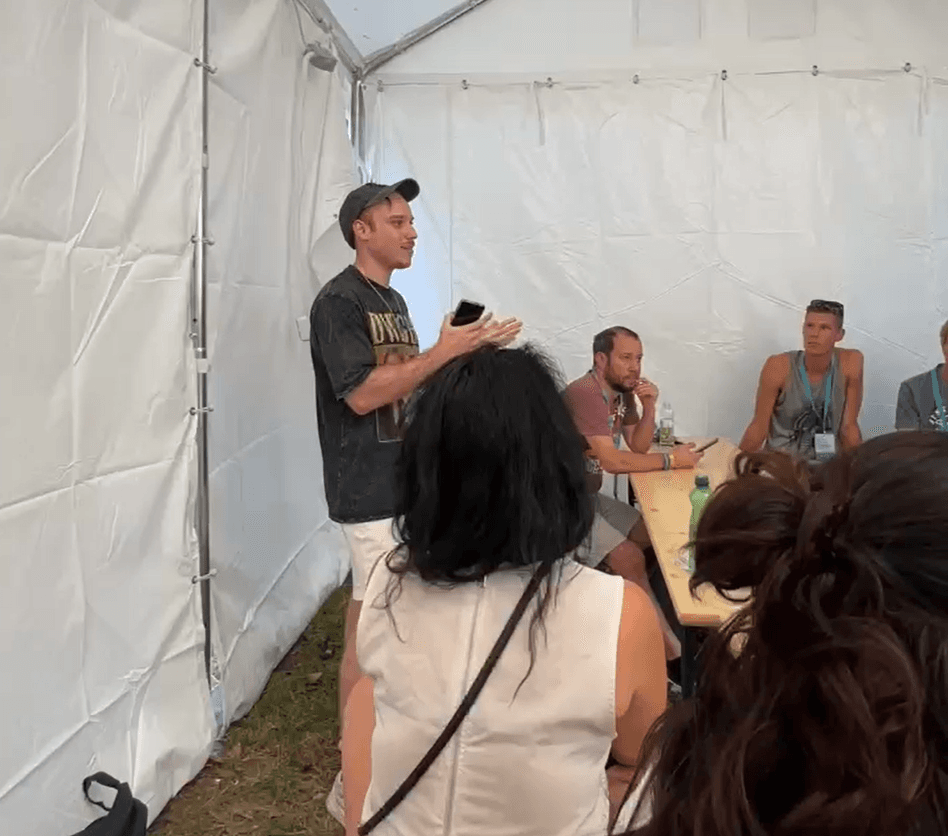 Finch speaking candidly with people at an event