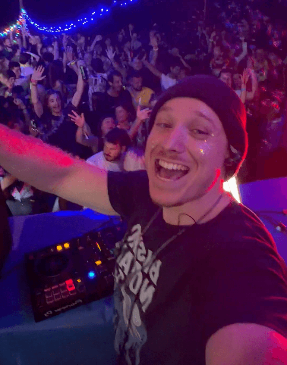 Finch DJing to a packed, cheering crowd