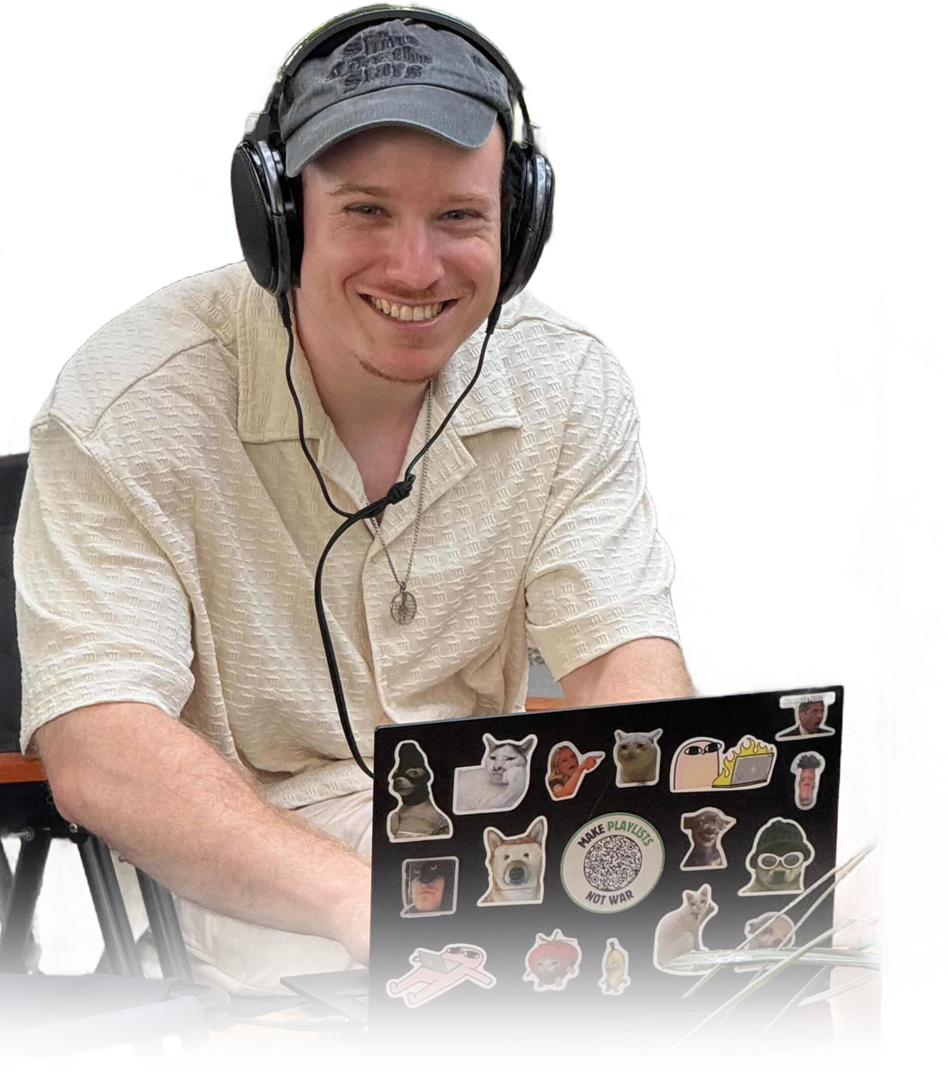 Finch Bergling working on a laptop with headphones on